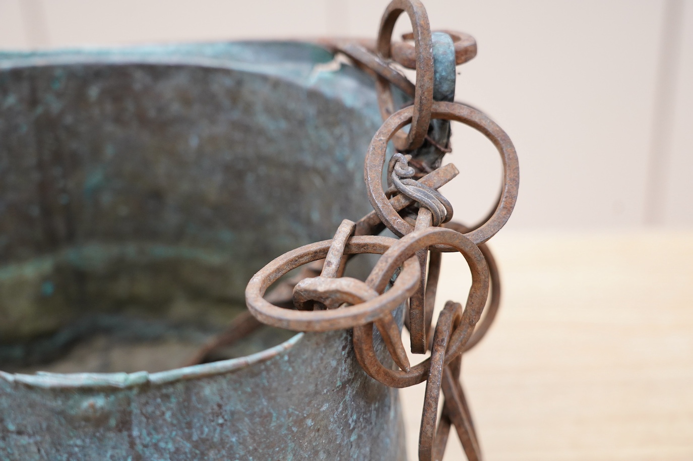 A 17th / 18th century copper cooking pot, 29cm to top of handle. Condition - poor